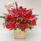 ramo de flores frescas  y rosas con follajes verdes y oso de peluche en canasta-de mimbre envio a domicilio en bogota 